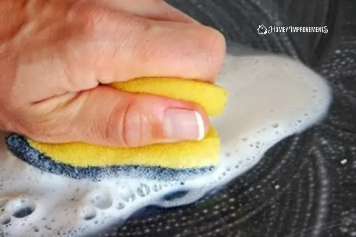 Rub the plastic Surface with Soapy Water