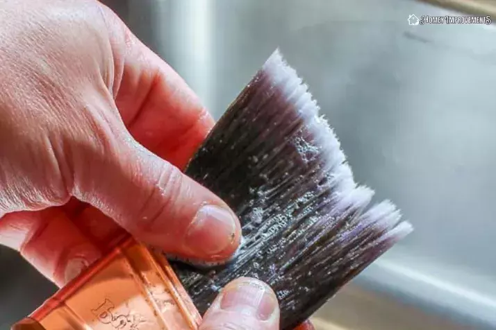 scrub the polyurethane brush under water