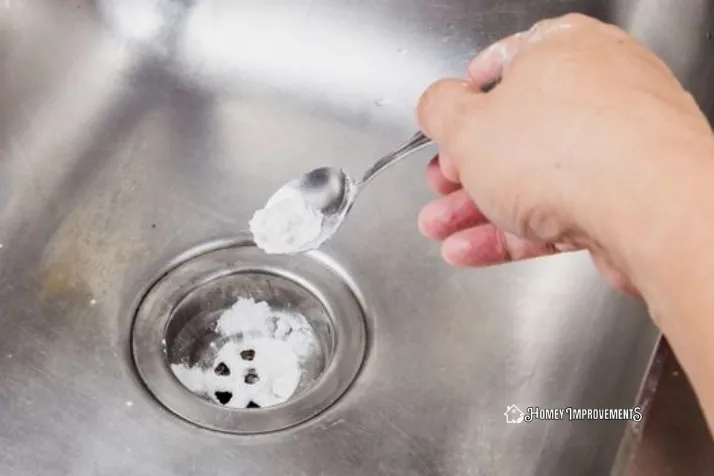 Sprinkle the Baking Soda on the drain